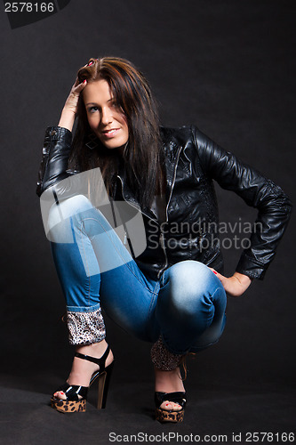 Image of Long-haired woman in a leather jacket