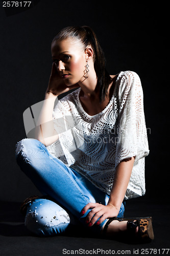 Image of Long-haired woman in white gauze blouse