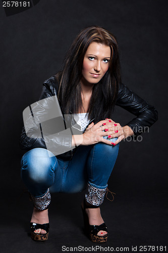 Image of Long-haired woman in a leather jacket