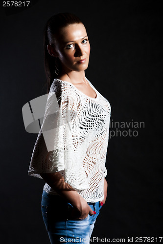 Image of Long-haired woman in white gauze blouse