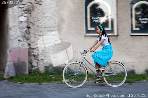 Image of Retro girl on old bike