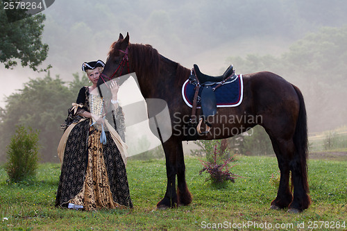 Image of Woman in dress royal baroque riding