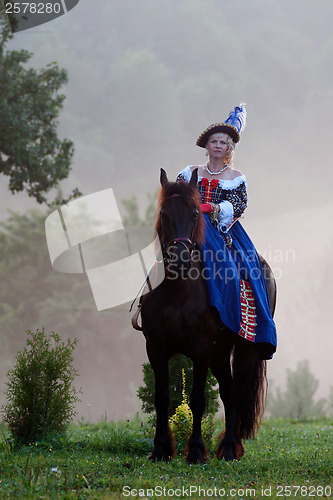 Image of Woman in dress royal baroque riding