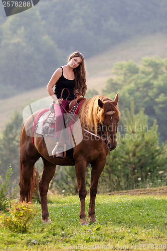 Image of Young girl with a horse