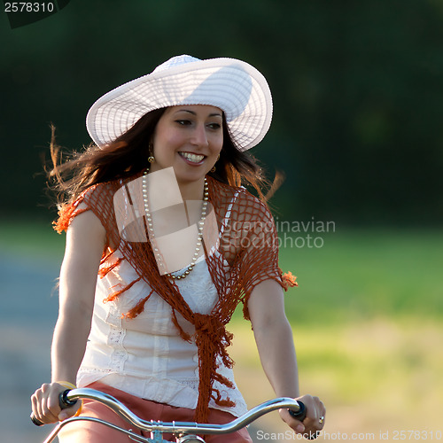 Image of Retro girl on old bike