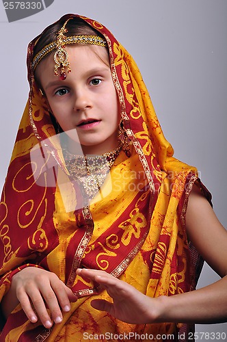 Image of little girl in traditional Indian clothing and jeweleries