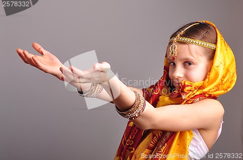 Image of little girl in traditional Indian clothing and jeweleries