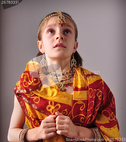 Image of little girl in traditional Indian sari and jeweleries