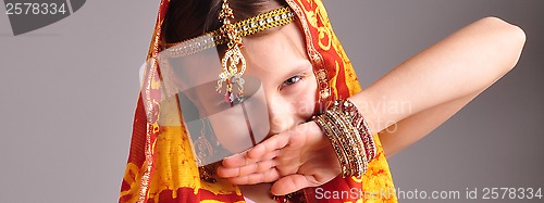 Image of little girl in traditional Indian clothing and jeweleries