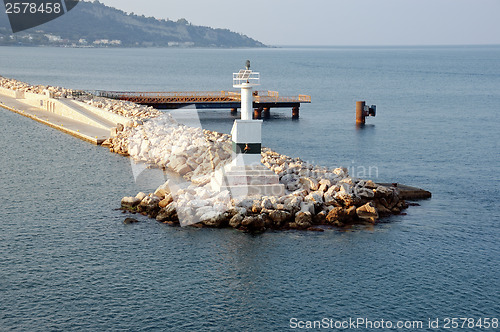 Image of lighthouse and rock jetty breakwater