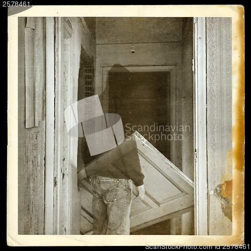 Image of vintage photo of ghost in haunted hallway