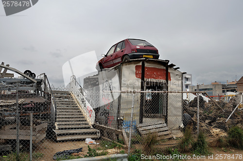 Image of rusty car and scrap metal