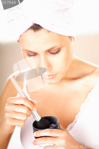 Image of Girl doing makeup