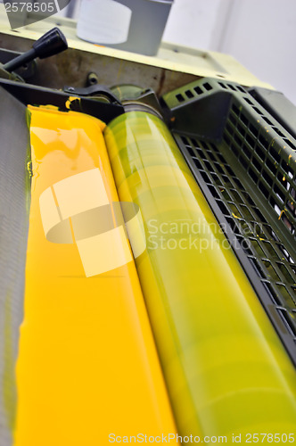 Image of printing press yellow paint