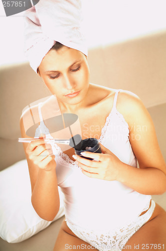 Image of Girl doing makeup