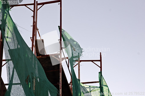 Image of torn debris netting scaffold