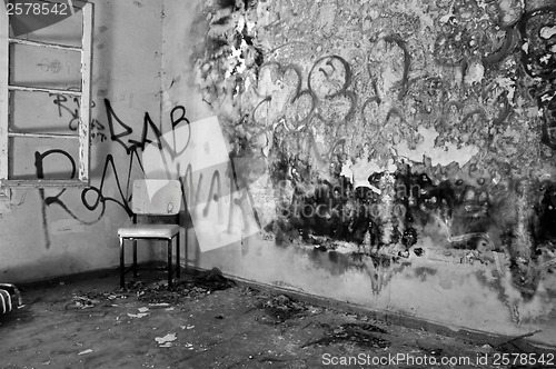 Image of chair in decayed room