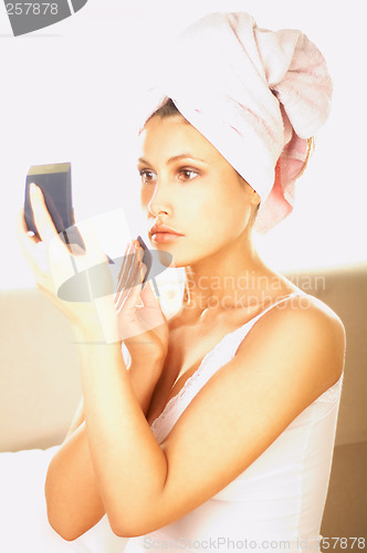 Image of Girl doing makeup