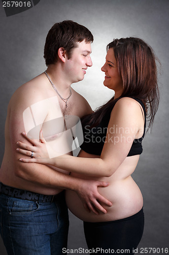 Image of Loving happy couple, pregnant woman with her husband