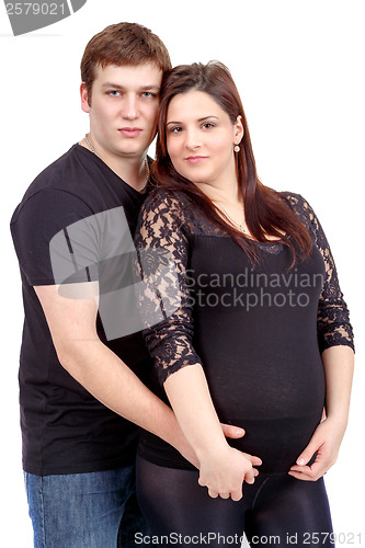 Image of loving happy couple, pregnant woman with her husband, isolated o