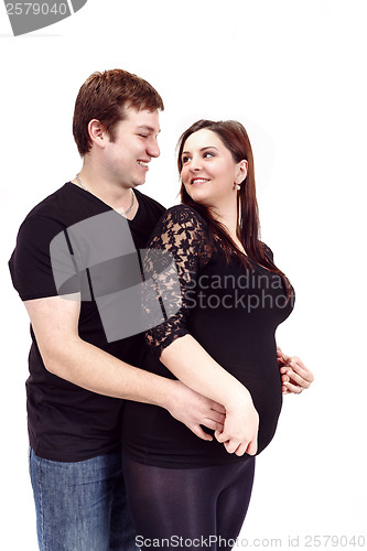 Image of loving happy couple, smiling pregnant woman with her husband