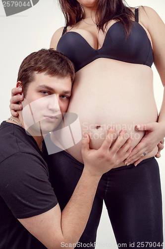 Image of loving happy couple pregnant woman with her husband