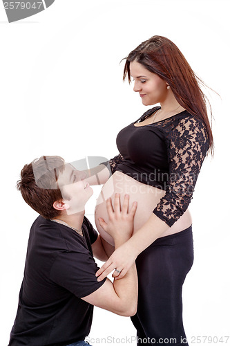 Image of loving happy couple, smiling pregnant woman with her husband
