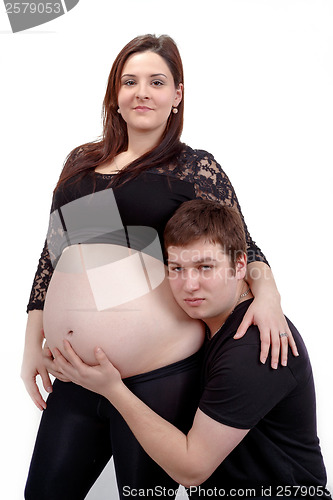 Image of loving happy couple, smiling pregnant woman with her husband