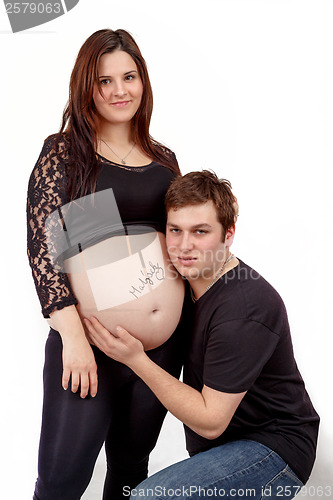 Image of loving happy couple, smiling pregnant woman with her husband