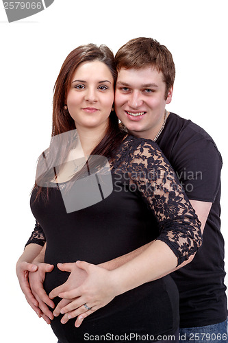 Image of loving happy couple, pregnant woman with her husband, isolated o