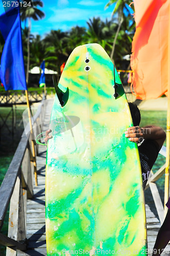 Image of Surfer with surfboard