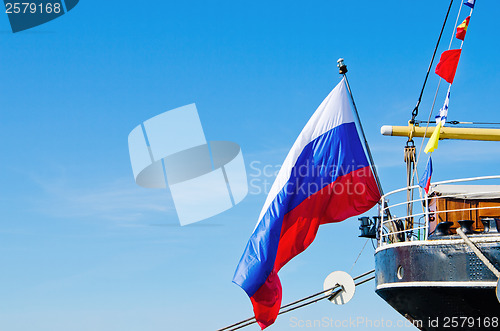 Image of Russian flag flies at the stern old sailboat
