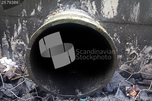 Image of environmental pollution. engine oil from a pipe