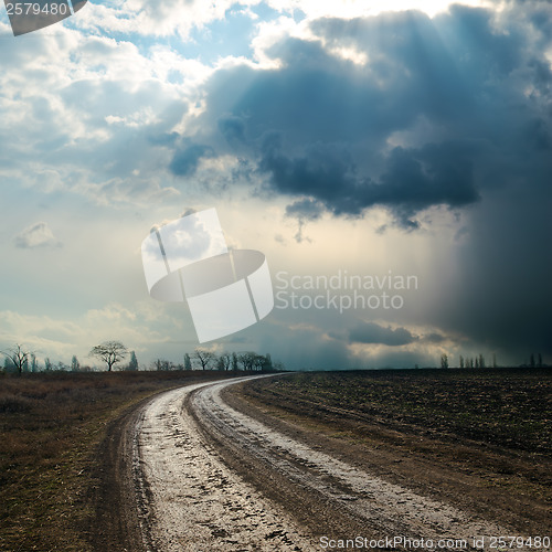 Image of dirty road to dramatic sky