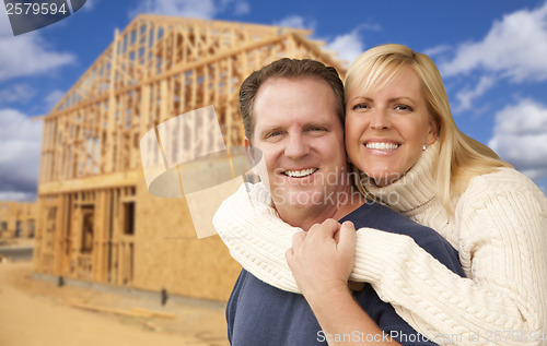 Image of Couple in Front of New Home Construction Framing Site