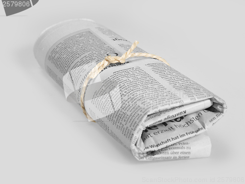 Image of rolled newspaper