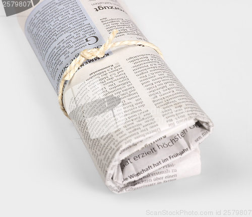Image of rolled newspaper