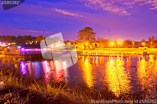 Image of restaurant on a lake at night