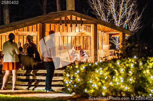 Image of visitors viewing live nativity play during christmas