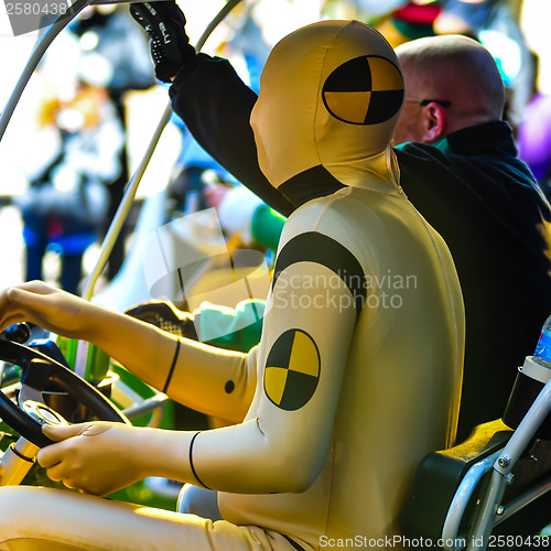 Image of dummy driving a golf cart