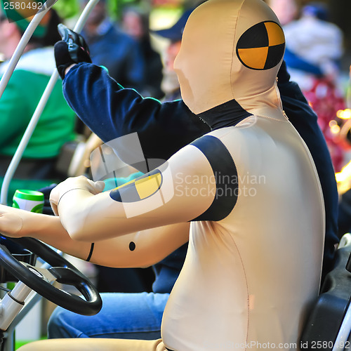 Image of dummy driving a golf cart