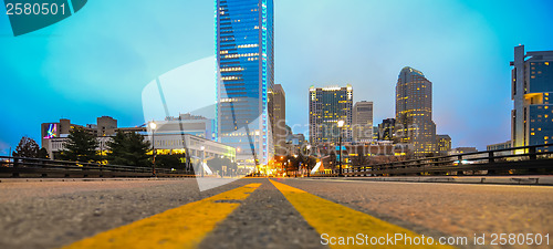 Image of charlotte skyline view from a highway overpass bridge