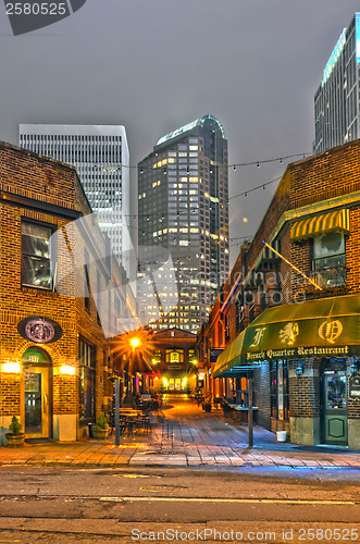 Image of charlotte, nc  - December 8, 2013: Night view of a narrow alley 