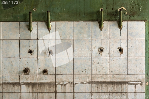 Image of Old tiled wall of an industrial building