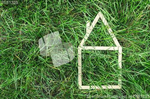 Image of Model house made on green grass