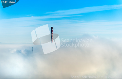 Image of Factory chimneys and clouds of steam