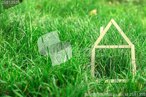 Image of Model house made on green grass