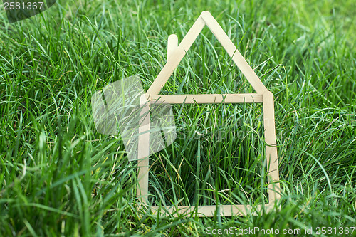 Image of Model house made on green grass