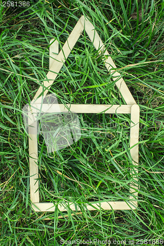Image of Model house made on green grass
