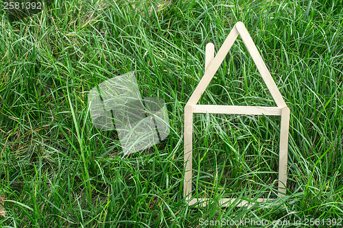 Image of Model house made on green grass